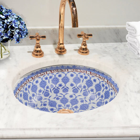 Nantucket Santorini Italian Fireclay Vanity Sink - RC78140M with blue patterned interior and elegant faucet.