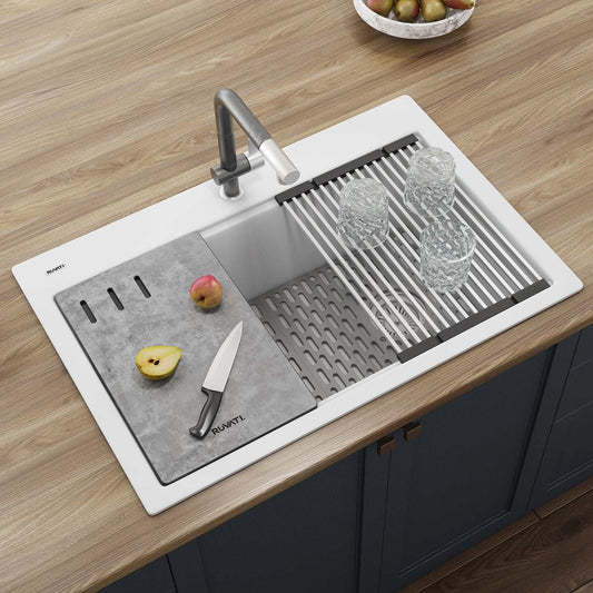 Ruvati epiStage 33" Workstation Drop-in Granite Kitchen Sink RVG1302WH with cutting board and glasses.