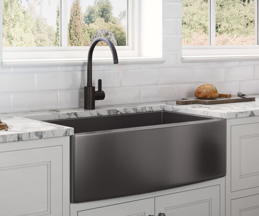 Ruvati Terraza 33" Stainless Steel Kitchen Sink RVH9733BL in a modern kitchen with stylish black faucet.