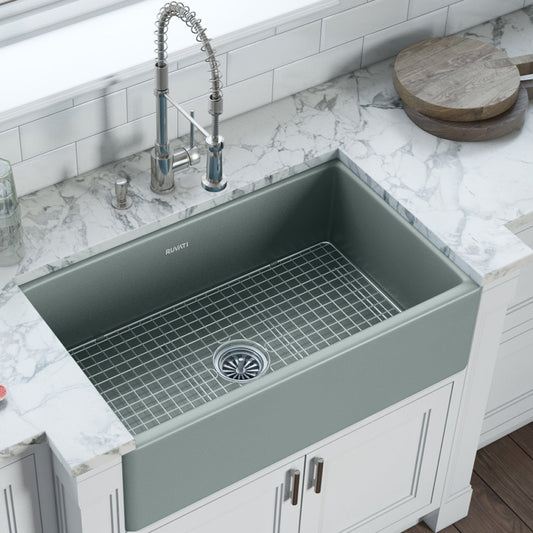 Ruvati Fiamma 33" Fireclay Reversible Single Bowl Kitchen Sink RVL2300GR in a modern kitchen with marble countertops.