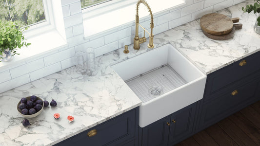 Ruvati Fiamma 23" Fireclay Kitchen Laundry Utility Sink RVL2468WH installed in elegant kitchen cabinetry.