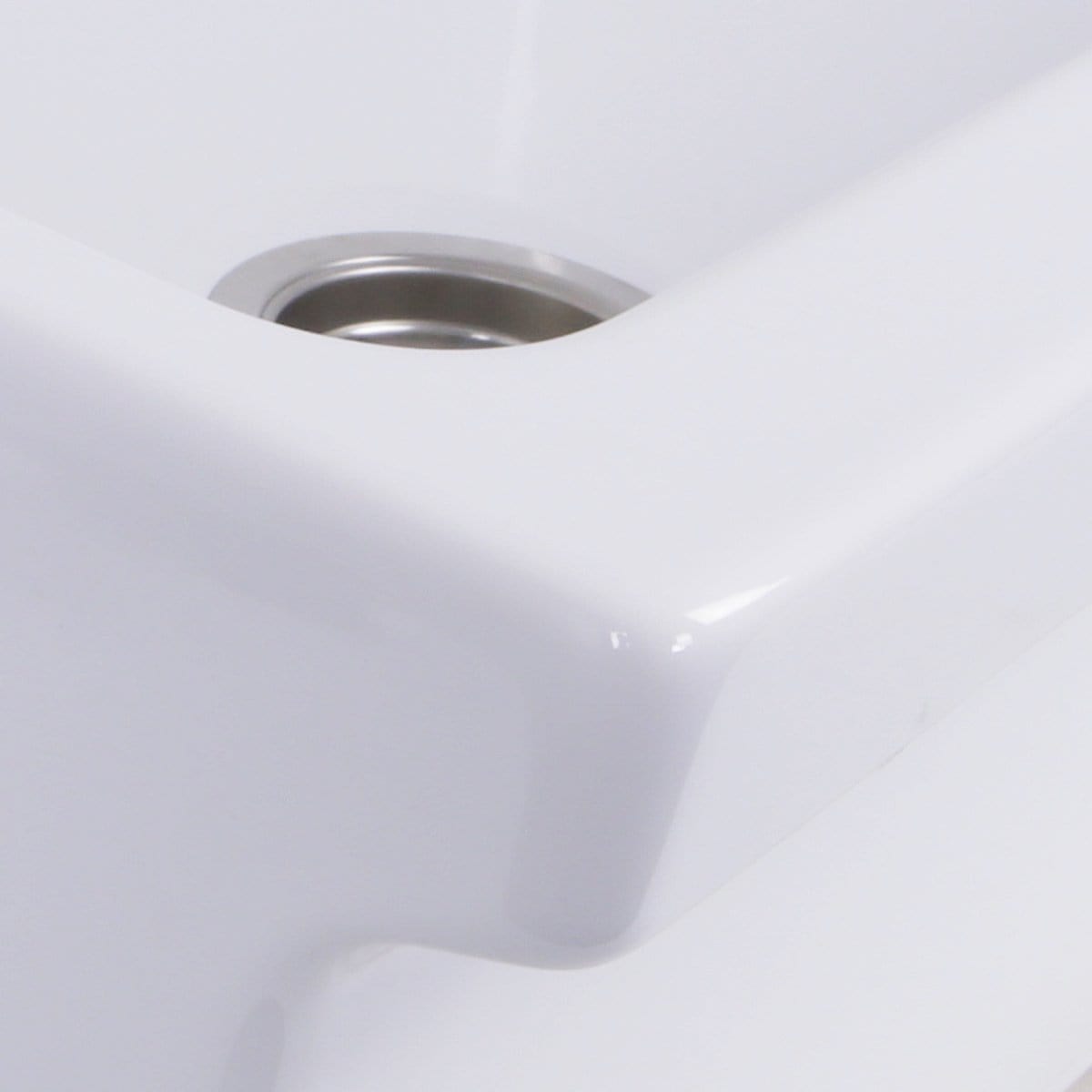Nantucket 36" Decorative Apron Farmhouse Fireclay Sink - Yarmouth-36W corner detail with stainless steel drain.