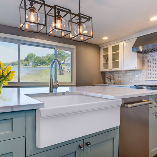 Nantucket 36" Decorative Apron Farmhouse Fireclay Sink - Yarmouth-36W installed in modern kitchen with pendant lights.