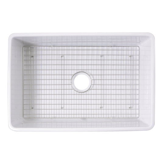 Nantucket Stainless Steel Bottom Grid - BG-VC30S installed in a white fireclay sink, designed for optimal drainage and protection.