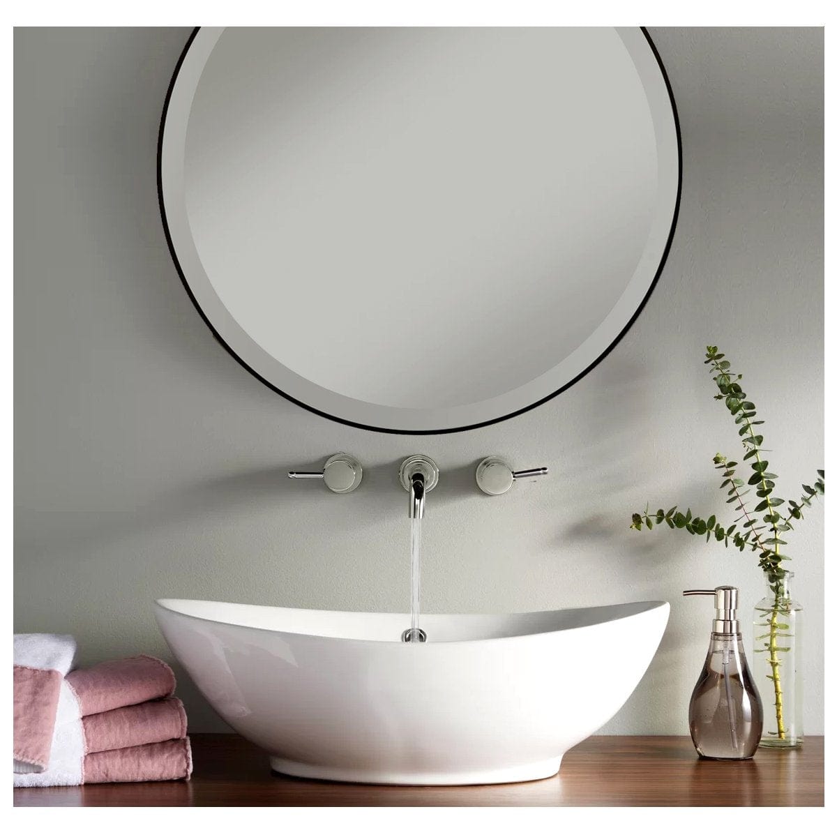 Nantucket Oblong White Vessel Sink - NSV305 with a modern round mirror above and cozy towels beside.