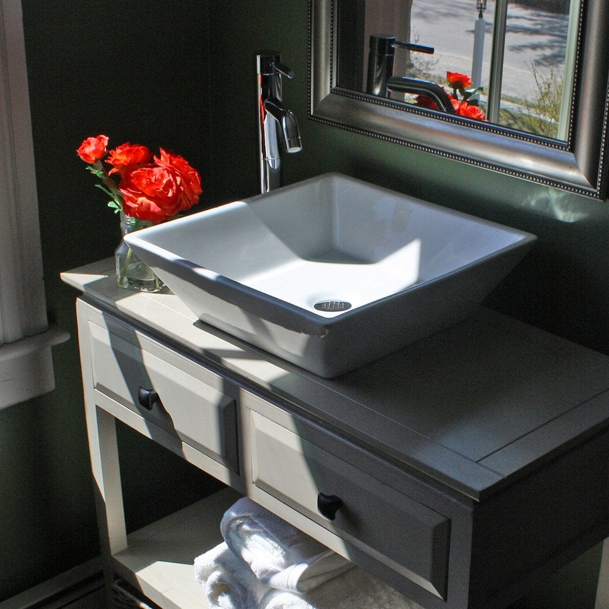 Nantucket Square Tapered White Vessel Sink - NSV109 elegantly displayed on a bathroom vanity with flowers.