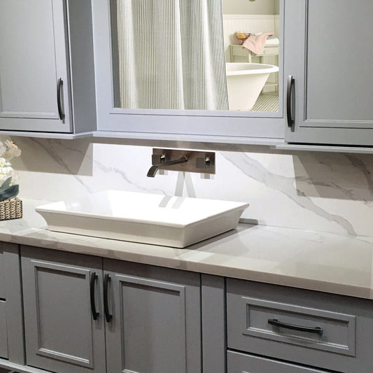 Nantucket Cannes Italian Fireclay Vanity Sink - RC73040W showcased in a modern bathroom setting with gray cabinetry.