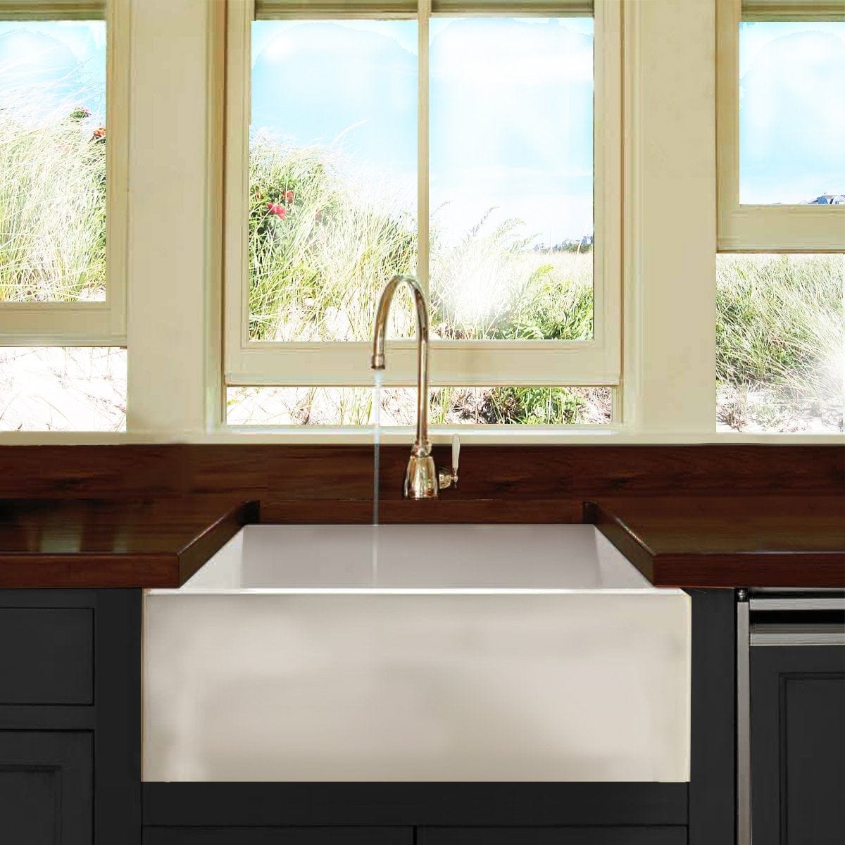 Nantucket 24" Farmhouse Apron Sink - Hyannis-24 showcased in a bright kitchen with large windows.