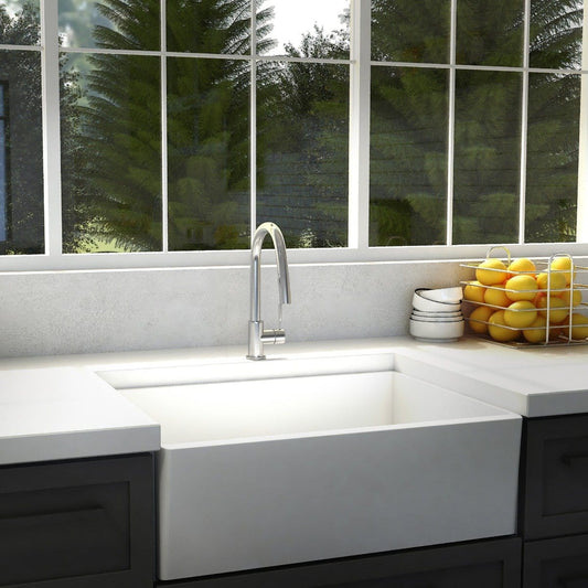 ZLINE Gemini Kitchen Faucet installed in a modern kitchen sink with a view of lush greenery outside.