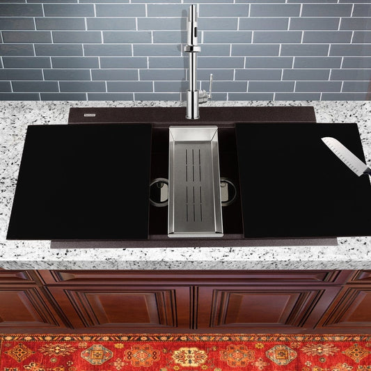 Nantucket Large Double Bowl Prep Station Granite Composite Brown on a granite countertop with modern faucet and accessories.