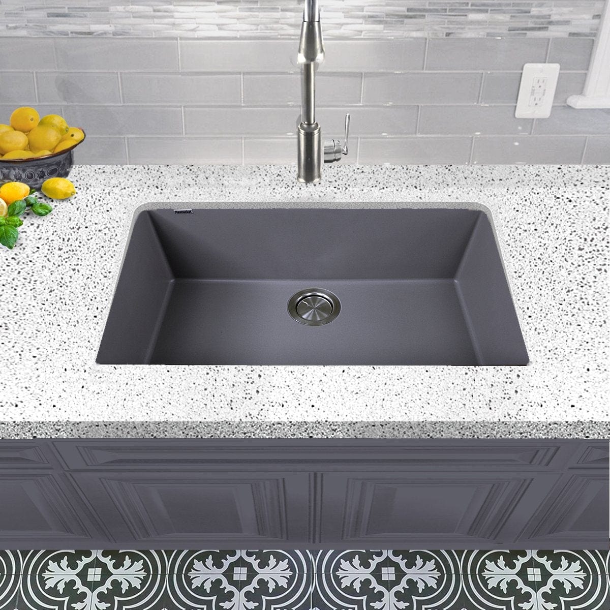 Nantucket Large Single Bowl Undermount Granite Composite Titanium in a modern kitchen setting with gray countertop.