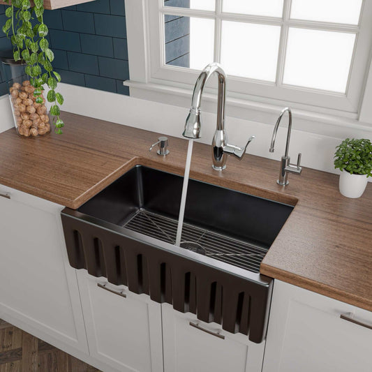 ALFI 30" Black Gloss Reversible Fireclay Farmhouse Sink with contemporary faucet in modern kitchen setting.