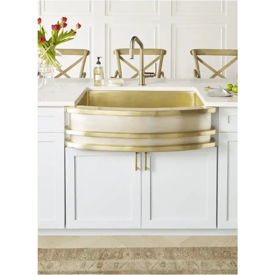 Brass sink changing color in a modern kitchen interior, illustrating why your brass sink changes color (and why that's a good thing).