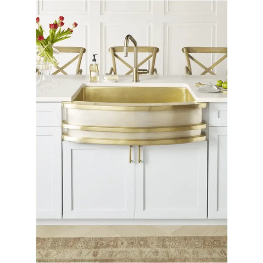 Brass sink changing color in a modern kitchen interior, illustrating why your brass sink changes color (and why that's a good thing).