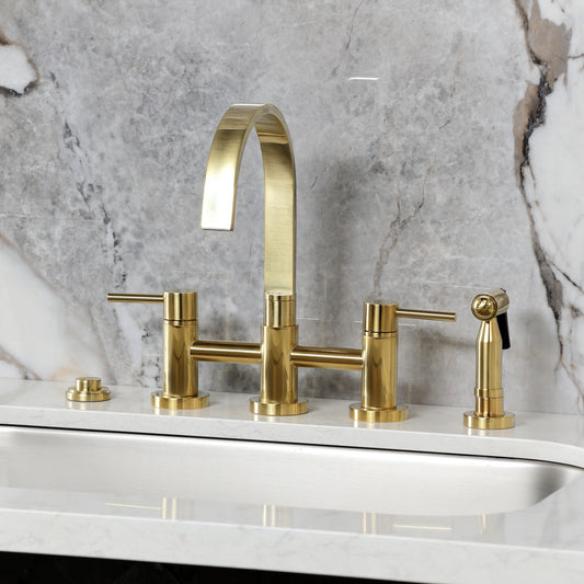 Kingston KS8267DLBS Concord Bridge Kitchen Faucet with Brass Sprayer, Brushed Brass on countertop with marble background.