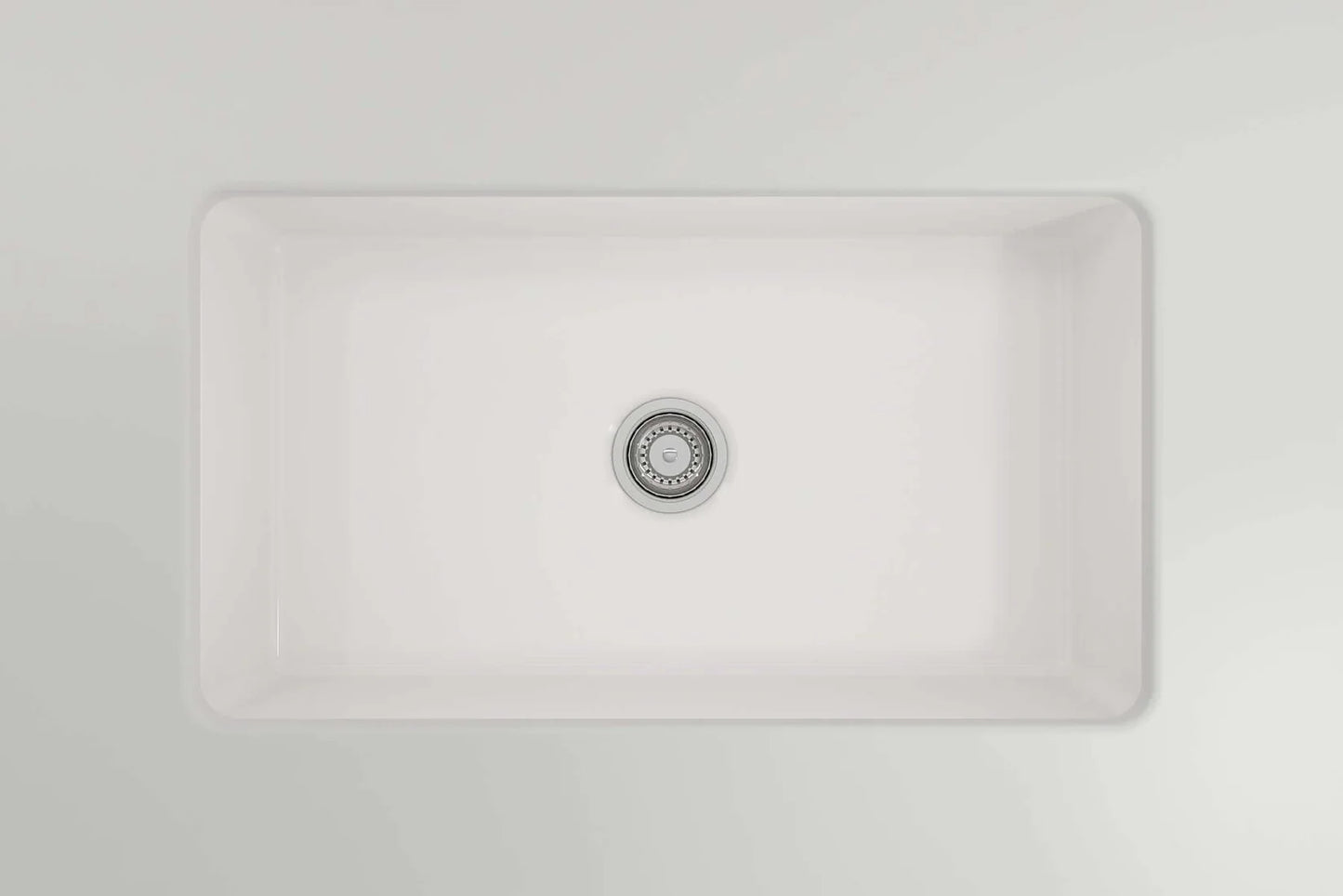 BOCCHI SOTTO 32" Fireclay Kitchen Sink with Pagano Faucet and Accessories overhead view of a white fireclay sink.