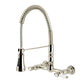 Kingston Brass GS1243BPL Bel-Air Double-Handle Wall-Mount Pre-Rinse Bridge Kitchen Faucet, Antique Brass in polished nickel finish.