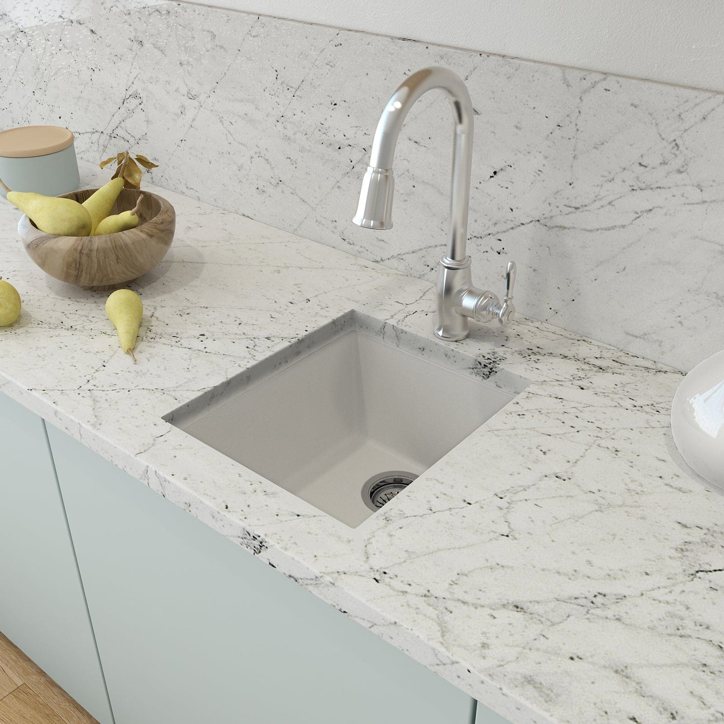 CAMPINO UNO 16" Single Bowl Dual Mount Granite Bar Sink with Strainer, Milk White finish, top view on marble countertop with faucet.