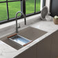 BOCCHI BAVENO LUX 34" Dual-Mount Single Bowl Granite Composite Kitchen Sink installation showing colander accessory in Mink color