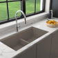 Lifestyle image of BOCCHI BAVENO LUX 34" Double Bowl Granite Composite Kitchen Sink with Integrated Workstation and Accessories in Mink color.