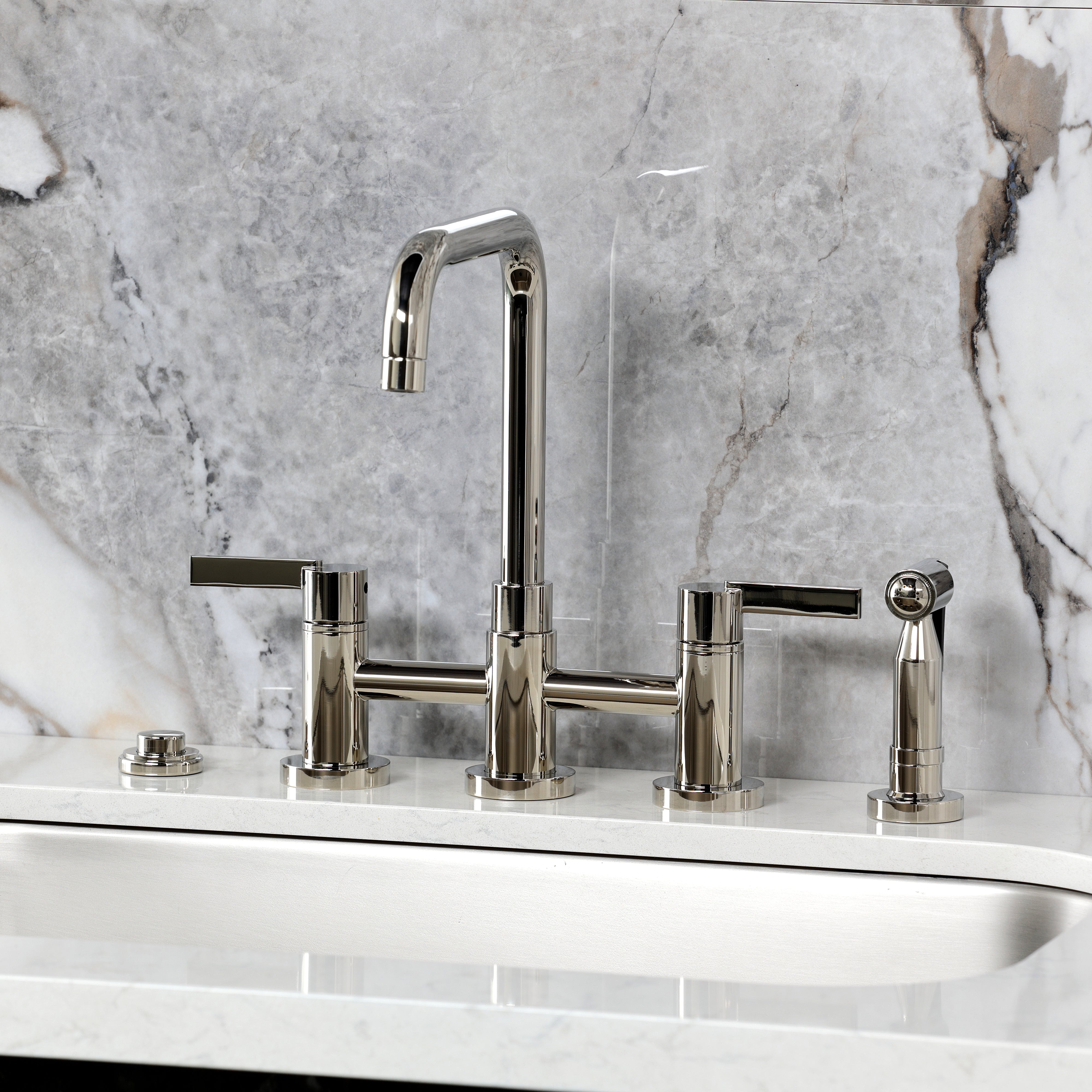 Kingston KS8287CTLBS Continental Bridge Kitchen Faucet with Brass Sprayer, Brushed Brass on a marble countertop.