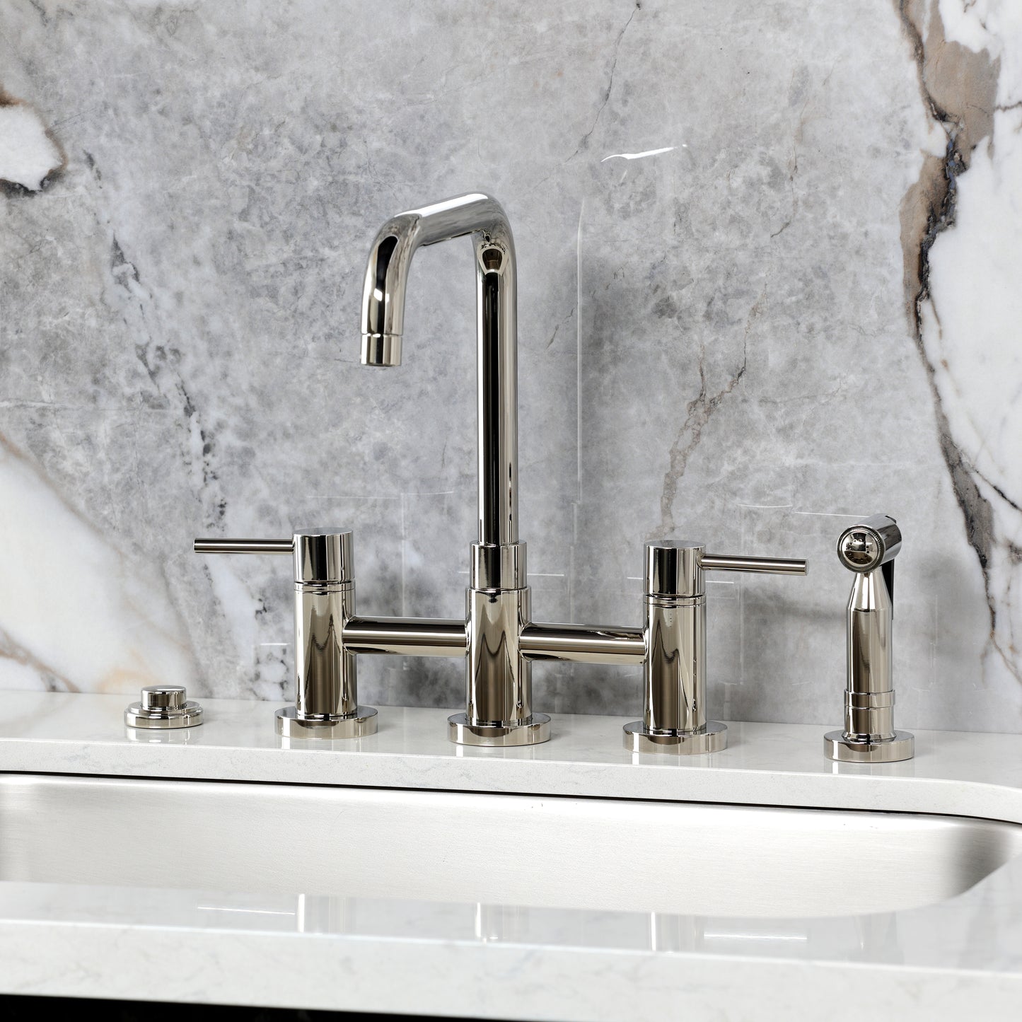 Kingston KS8287DLBS Concord Bridge Kitchen Faucet with Brass Sprayer, Brushed Brass image against marble backdrop