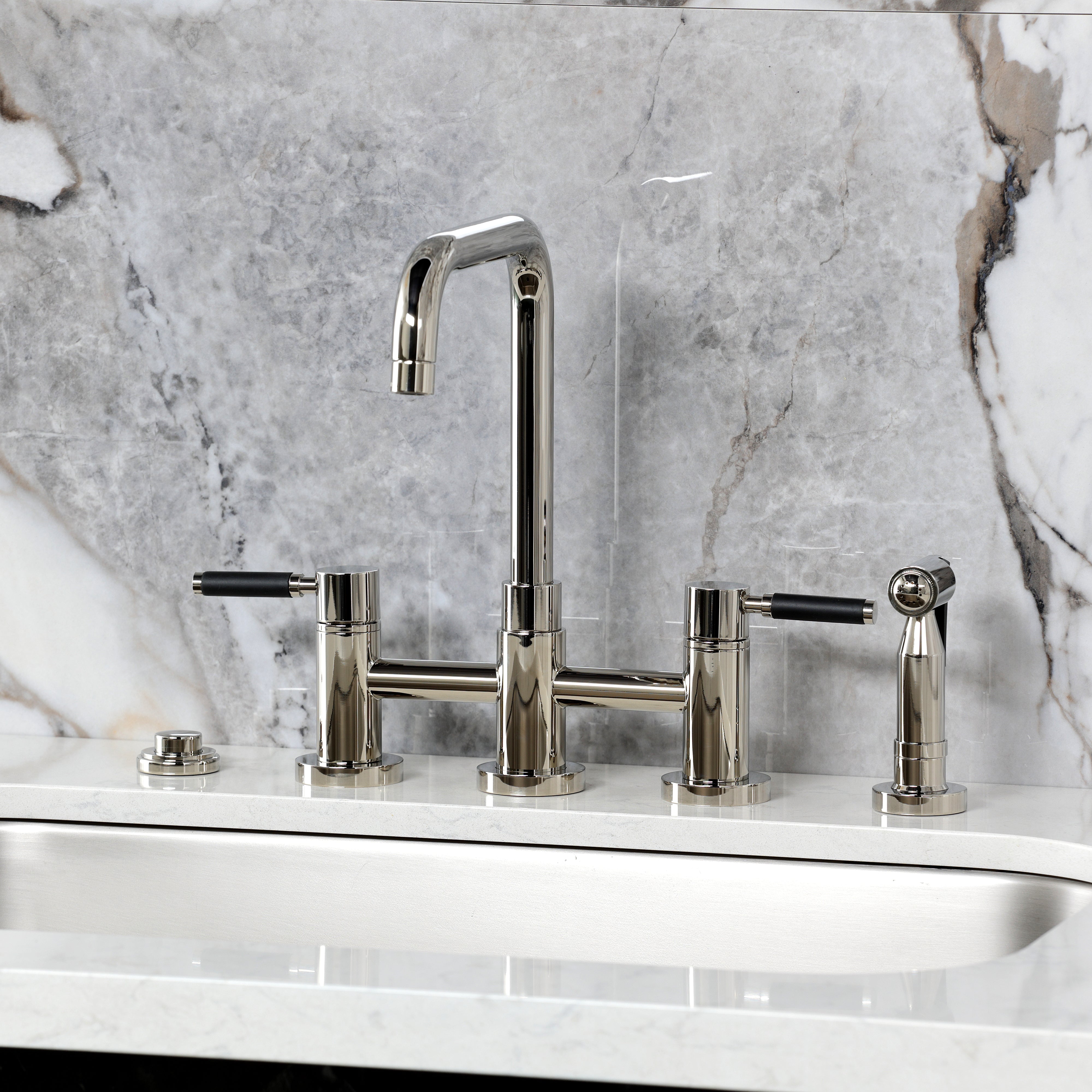 Kingston KS8287DKLBS Kaiser Bridge Kitchen Faucet with Brass Sprayer, Brushed Brass on marble background