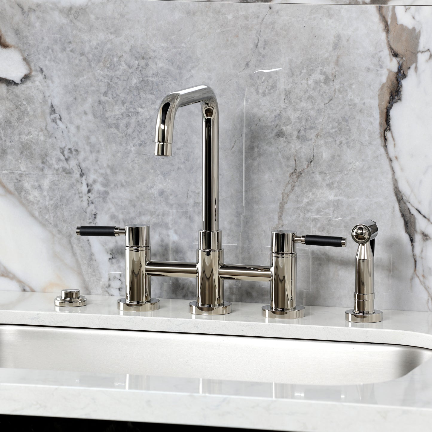 Kingston KS8287DKLBS Kaiser Bridge Kitchen Faucet with Brass Sprayer, Brushed Brass on marble background