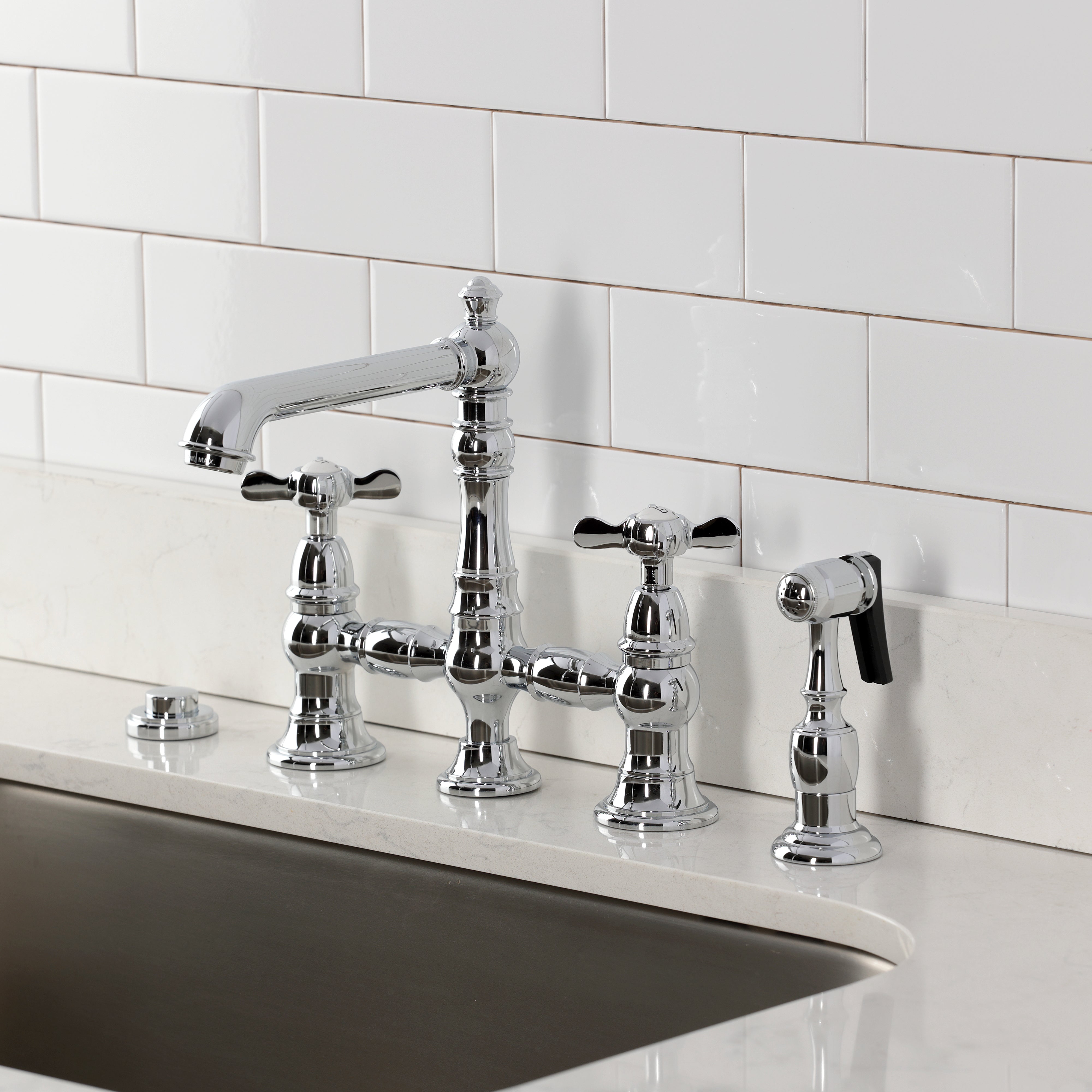 Kingston KS7277BEXBS Essex Bridge Kitchen Faucet with Brass Sprayer, Brushed Brass on a kitchen countertop.