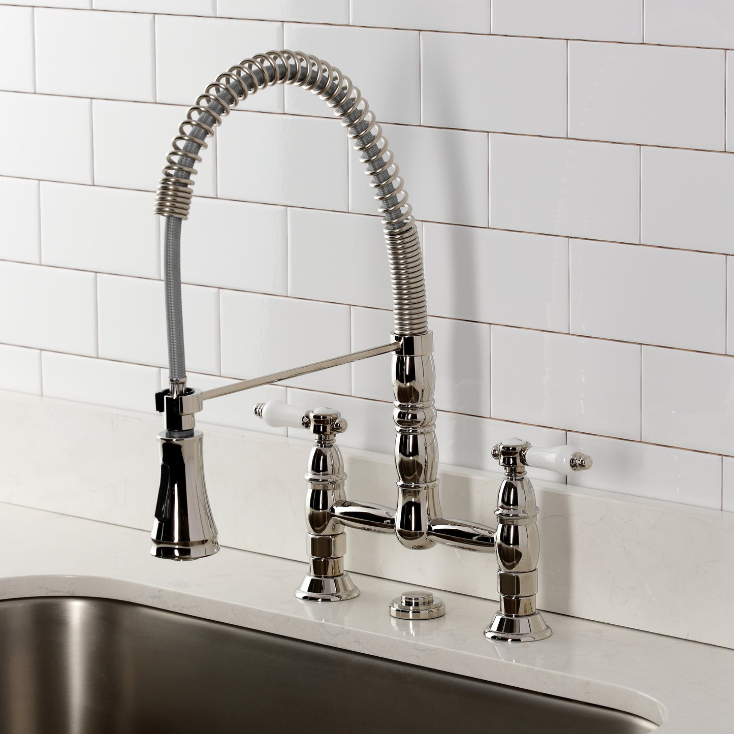 Kingston Brass GS1273BPL Bel-Air Double-Handle Deck-Mount Pre-Rinse Bridge Kitchen Faucet, Antique Brass with polished finish