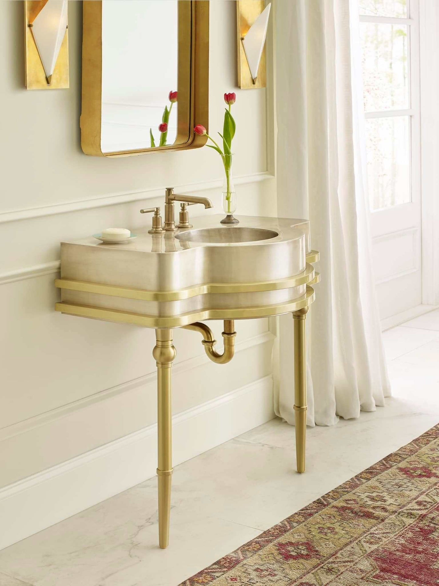 Thompson Traders Quintana Vanity - KCV32 featuring elegant curves and sophisticated metals in a stylish bathroom setting.