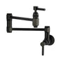Kingston Brass KS5103DL Concord Wall Mount Pot Filler Faucet, Antique Brass with matte black finish.