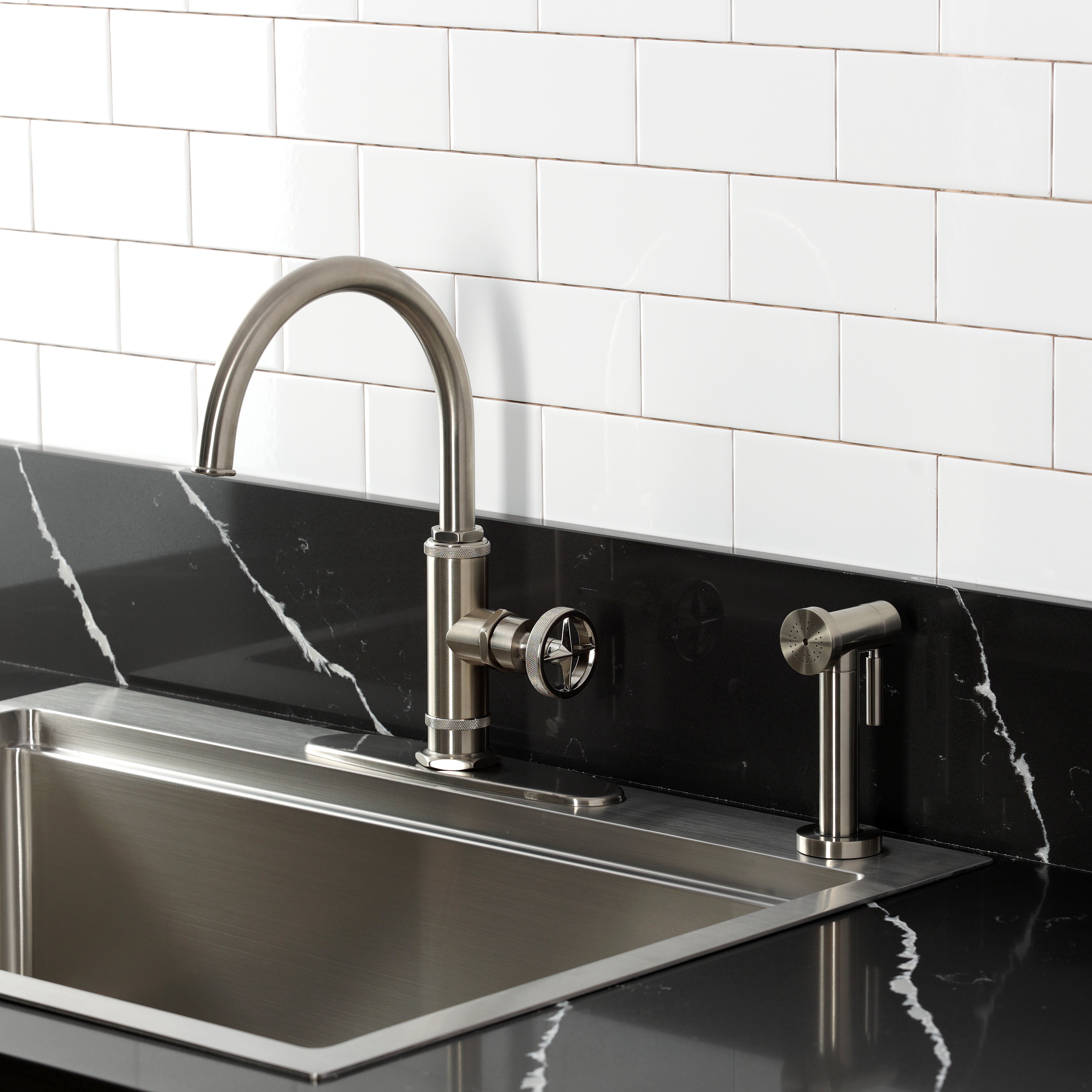 Kingston Brass KSD2433RNX Ostro Single-Handle Kitchen Faucet, Antique Brass with side spray in a modern kitchen.