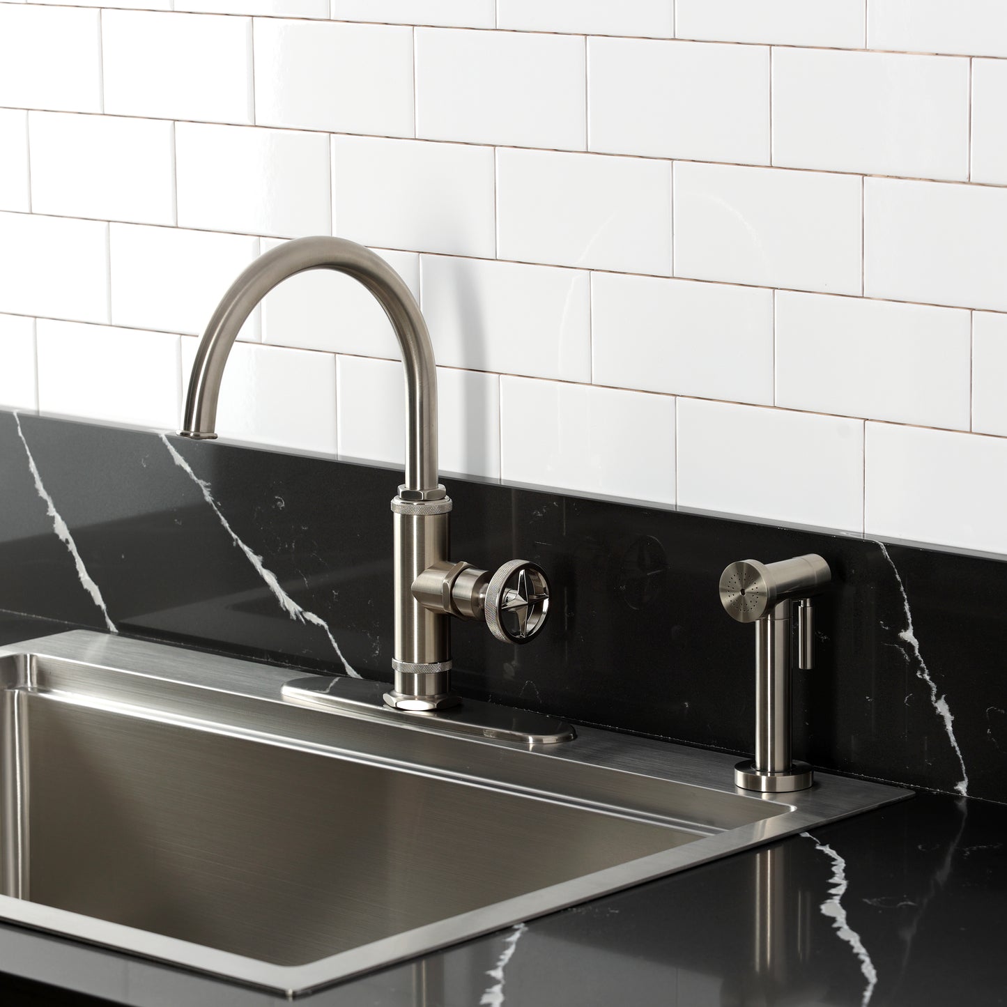 Kingston Brass KSD2433RNX Ostro Single-Handle Kitchen Faucet, Antique Brass with side spray in a modern kitchen.