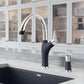 BLANCO Artona Pull-Down Dual-Spray Kitchen Faucet in modern kitchen setting with sleek design and integrated soap dispenser.