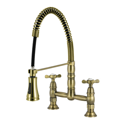 Kingston Brass GS1273BEX Essex Double-Handle Deck-Mount Pre-Rinse Bridge Kitchen Faucet, Antique Brass with exposed spring design.
