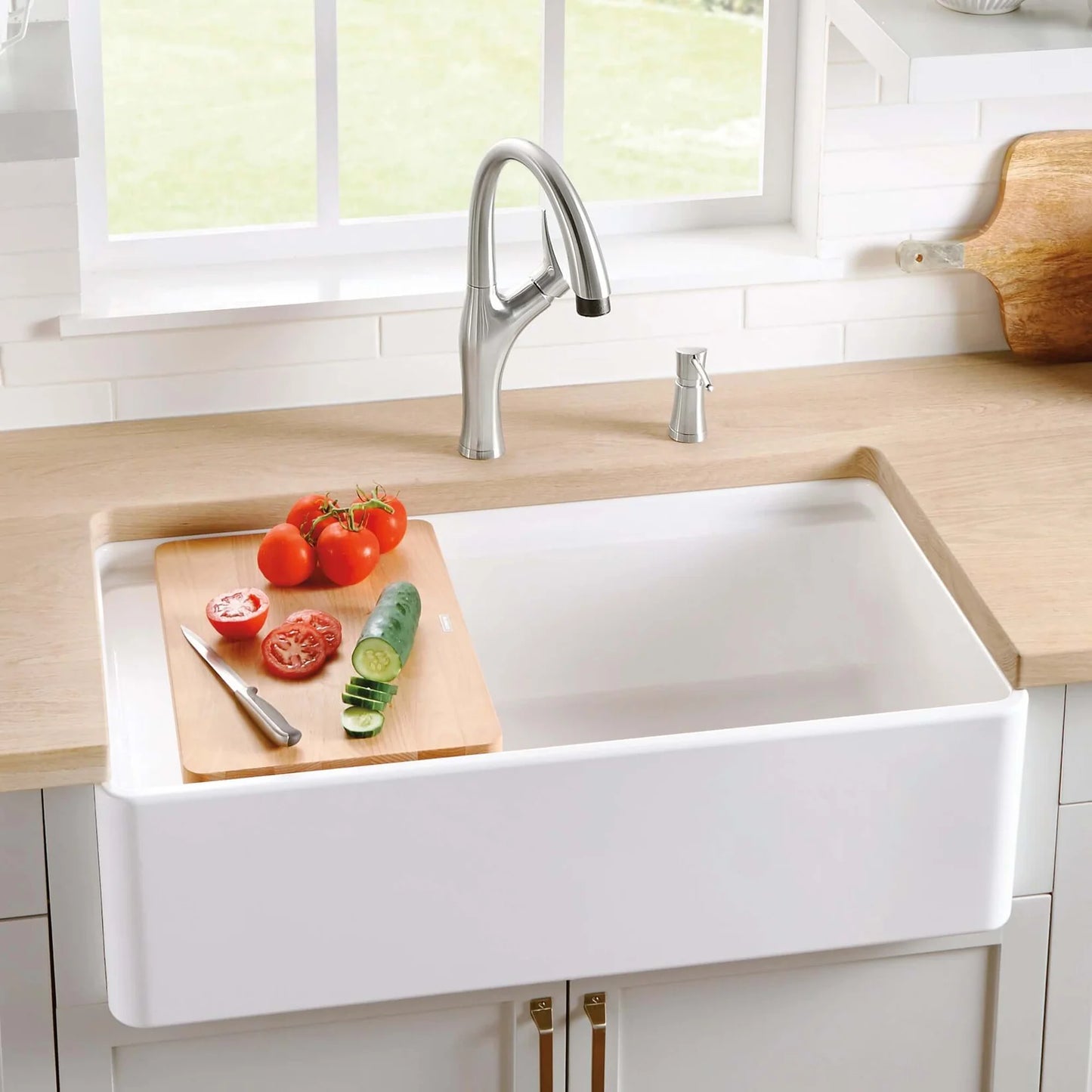 Blanco Performa 36" fireclay farmhouse sink with included cutting board, paired with a modern faucet