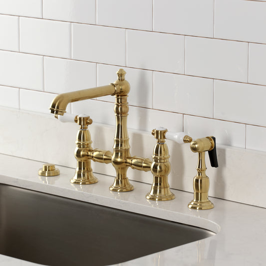 Kingston KS7277BPLBS Bel-Air Bridge Kitchen Faucet with Brass Sprayer, Brushed Brass in a traditional kitchen setting.