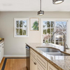 Nantucket 31.5" 70/30 Double Bowl Undermount Stainless Steel Kitchen Sink, 16 Gauge - NS3121-16 in a modern kitchen setting.