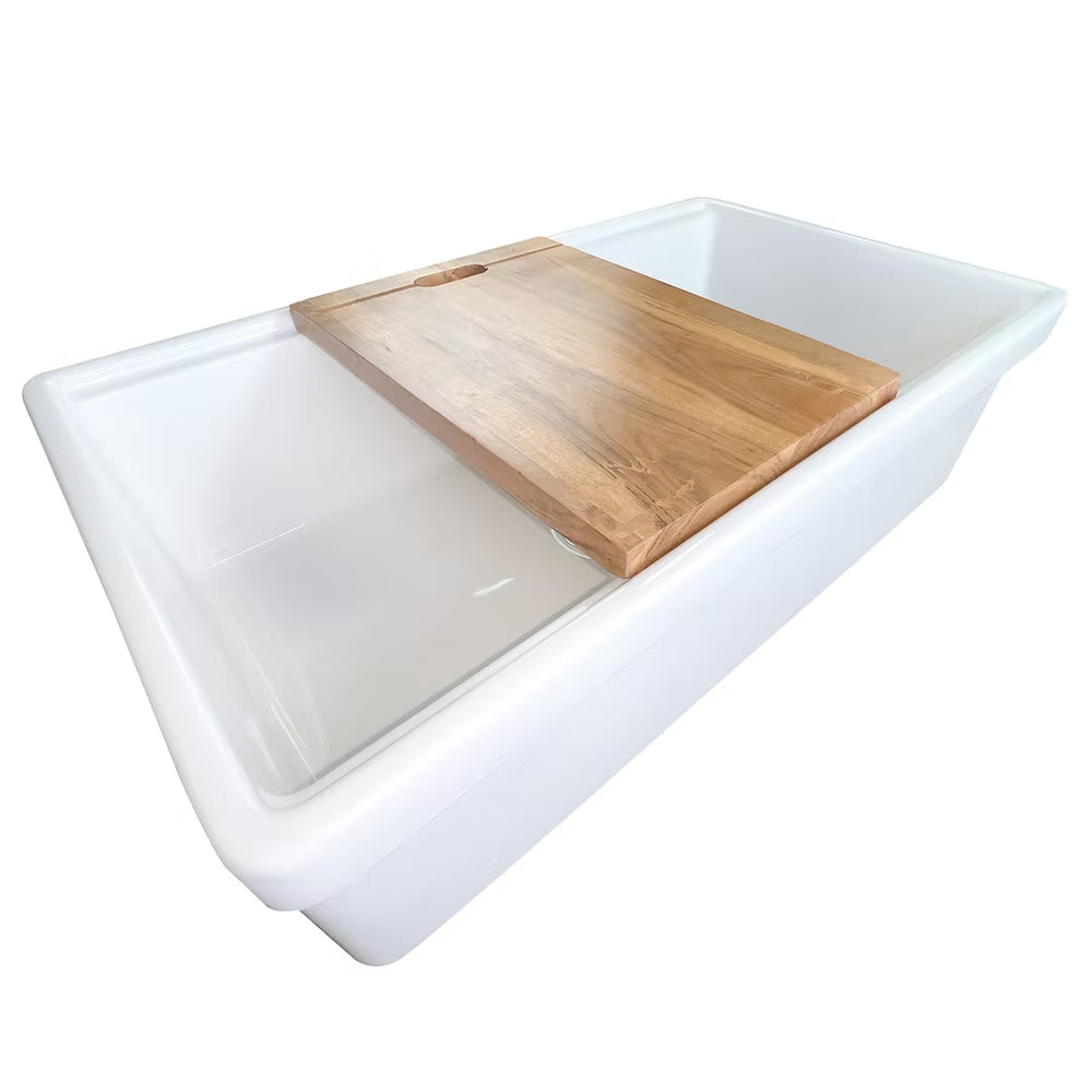 Nantucket Dennis 33 inch white ceramic sink with a wooden cutting board on top