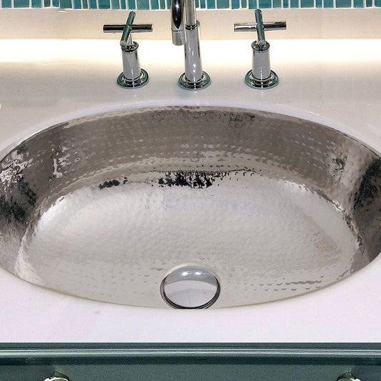 Nantucket Hand Hammered Stainless Steel Oval Undermount Bathroom Sink With Overflow - OVS-OF in a modern bathroom setting.