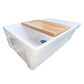 White Nantucket 33 inch Dennis reverisble kitchen sink with a wooden cutting board on top