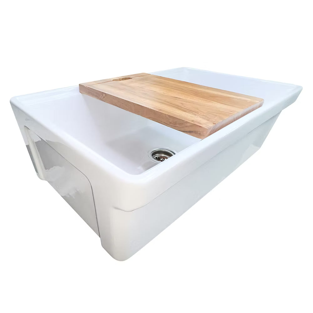 White Nantucket 33 inch Dennis reverisble kitchen sink with a wooden cutting board on top