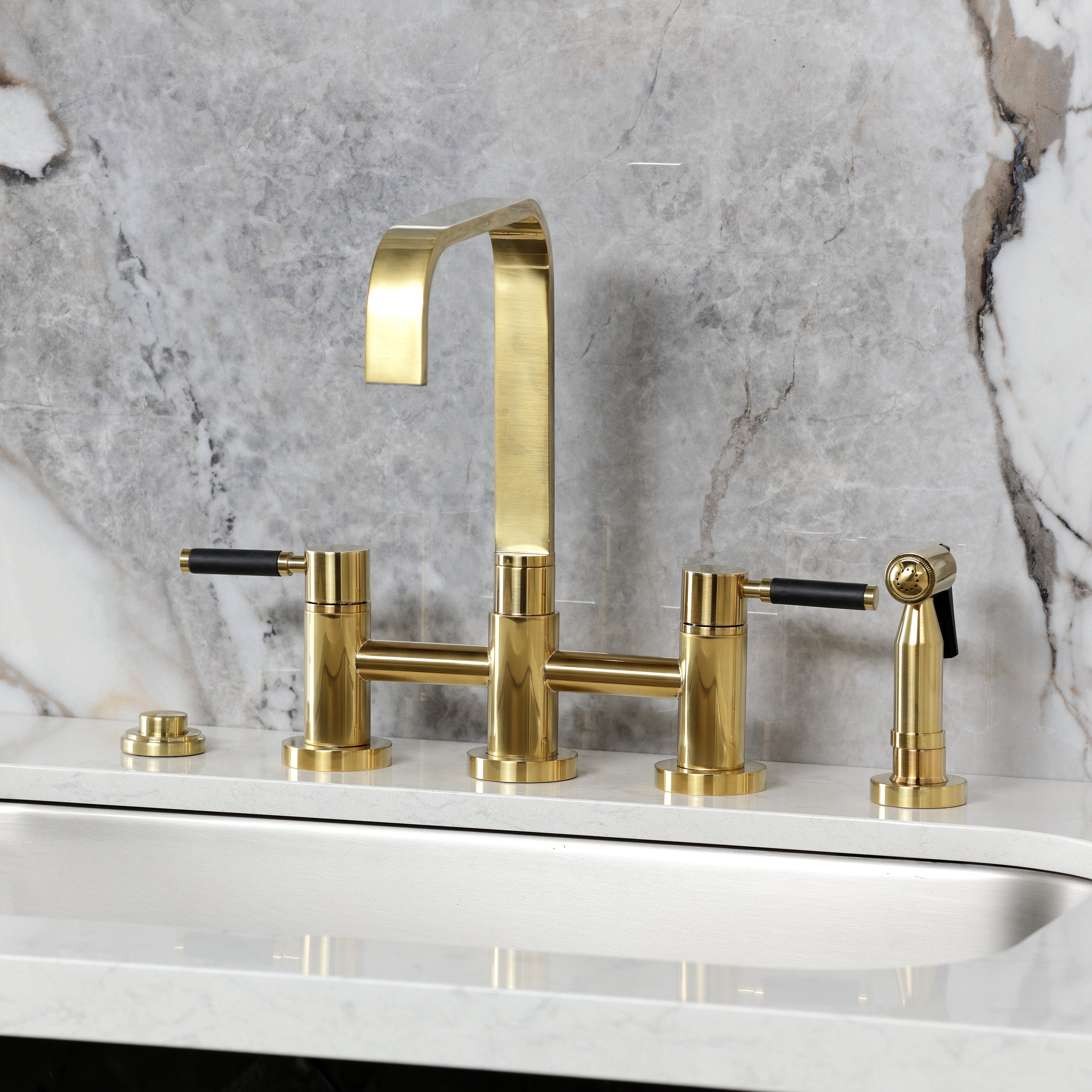Kingston KS8257DKLBS Kaiser Bridge Kitchen Faucet with Brass Sprayer, Brushed Brass on marble countertop