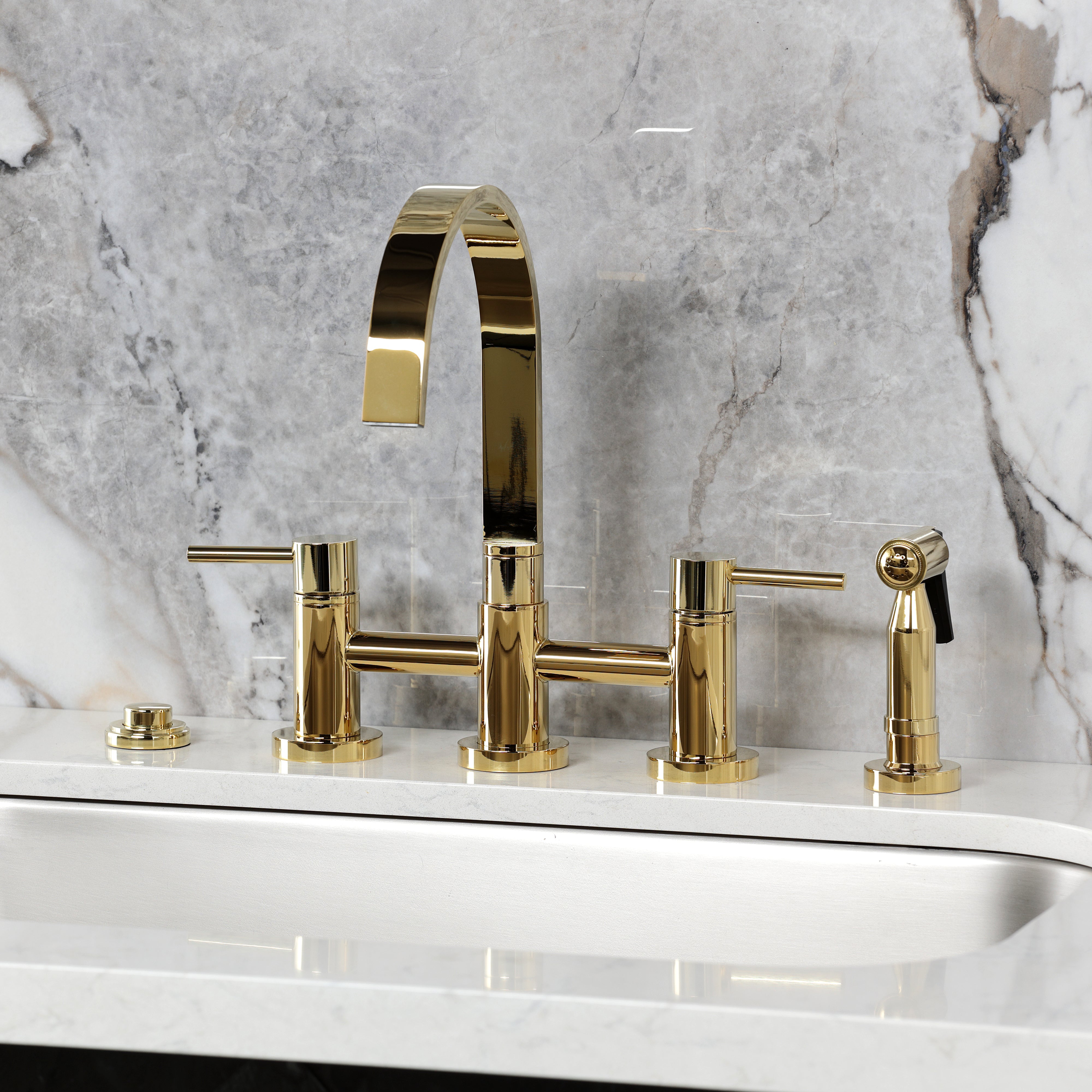 Kingston KS8267DLBS Concord Bridge Kitchen Faucet with Brass Sprayer, Brushed Brass on marble countertop.