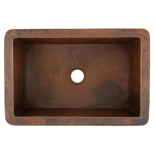 Thompson Cardenas 33" Aged Copper Farmhouse Kitchen Sink - 2KS, top view of hand-hammered copper sink with centered drain hole.