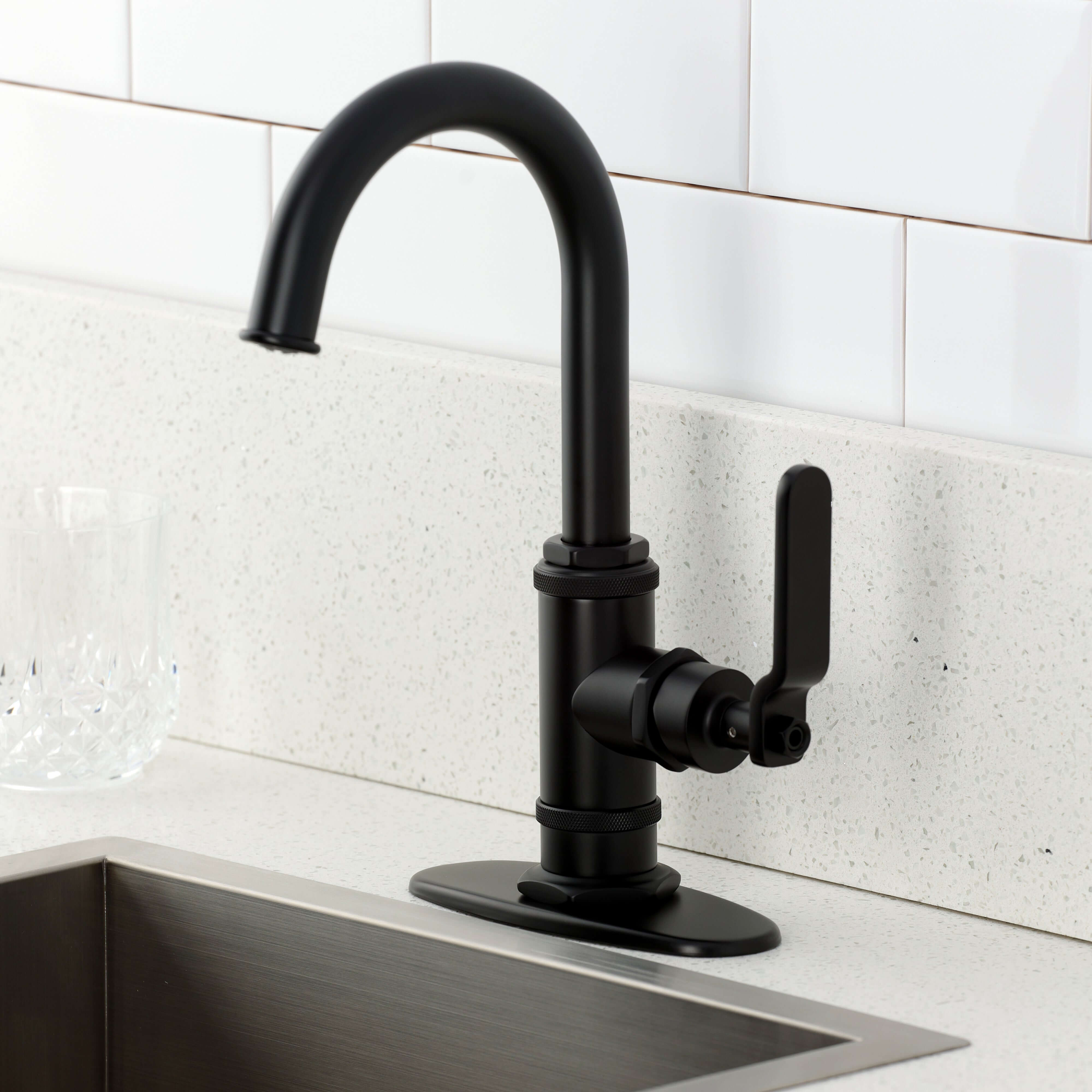 Kingston Brass KSD8503KL Whitaker Single-Handle Bar Faucet, Antique Brass on a modern kitchen counter.