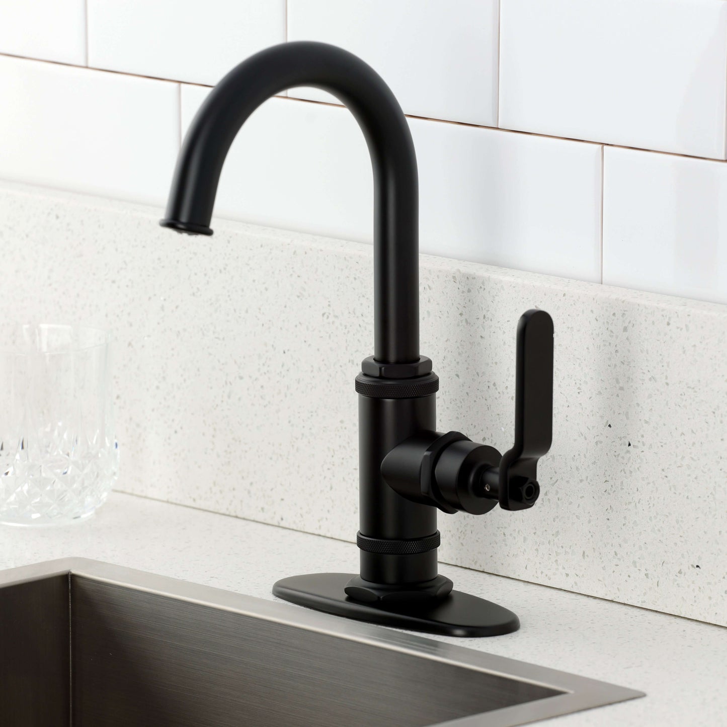 Kingston Brass KSD8503KL Whitaker Single-Handle Bar Faucet, Antique Brass on a modern kitchen counter.