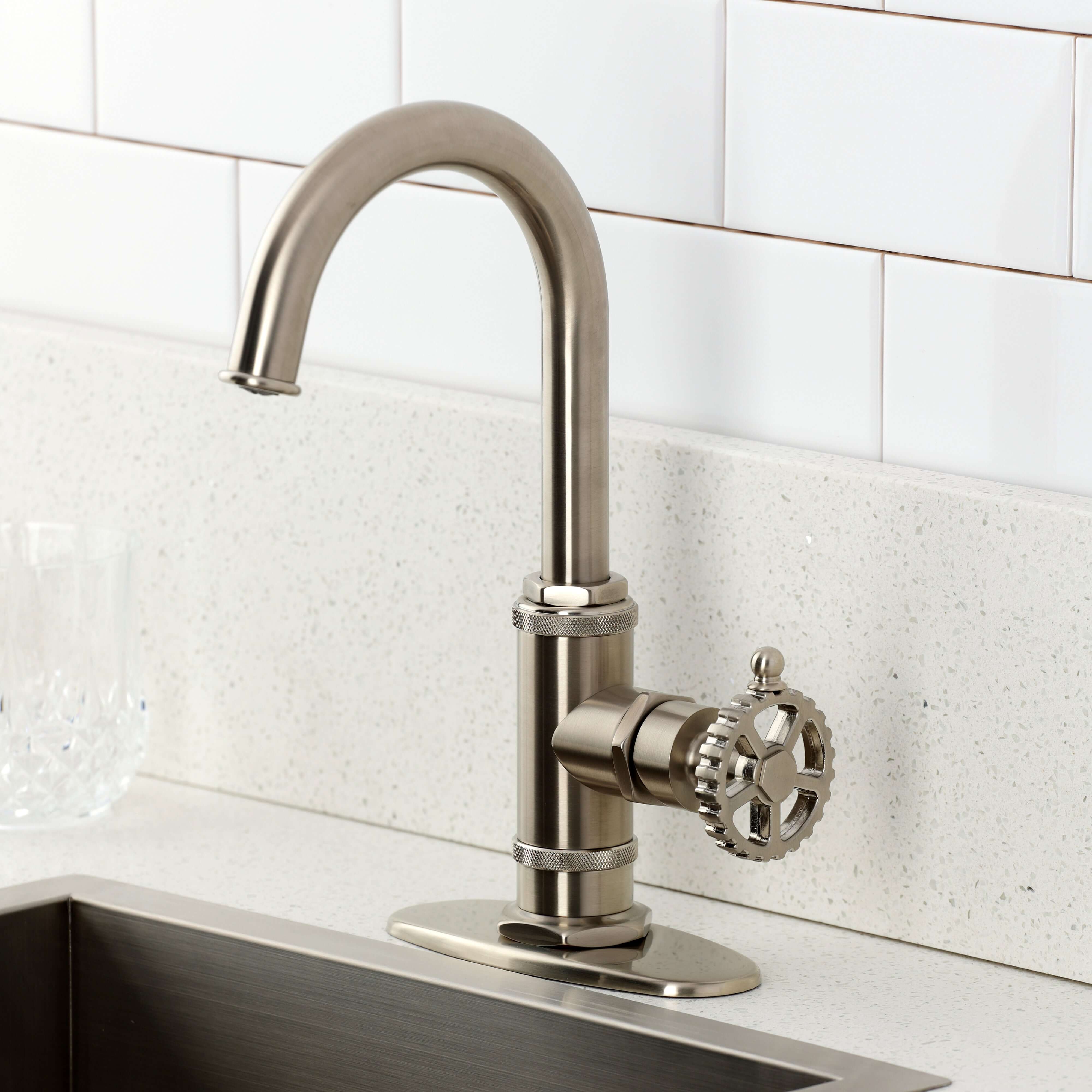 Kingston Brass KSD8503CG Fuller Single-Handle Bar Faucet, Antique Brass installed in modern kitchen setting.