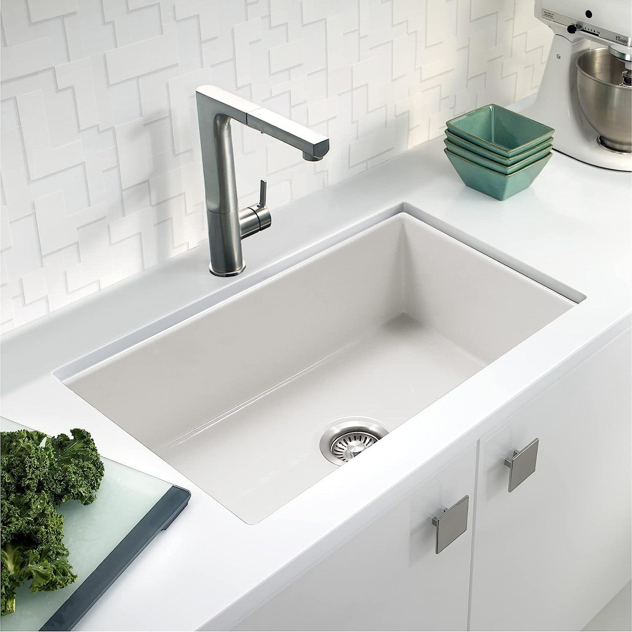 Houzer 32" fireclay undermount  kitchen sink in a clean, white kitchen setting.